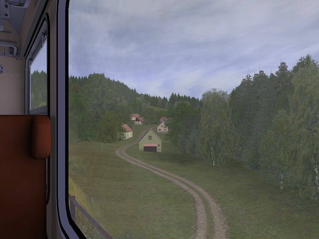 pohled z vagonu na sjezd do malebn� vesni�ky v �dol� Trutnovsk�ch les�